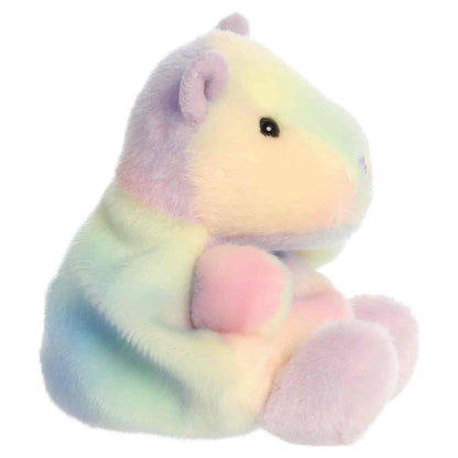 Side profile view of Aurora Palm Pals Seb Sorbet Capybara plush showing pastel gradient swirls and upright seated posture.