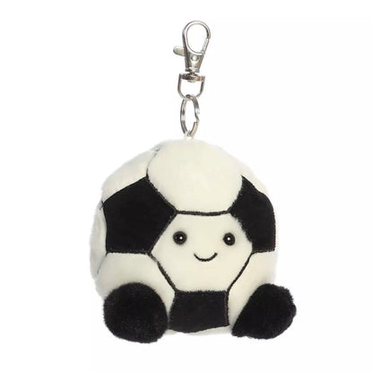 Head-on front view of Aurora Palm Pals Striker Soccer plush showing smiling face, black feet, and metal swivel clasp.