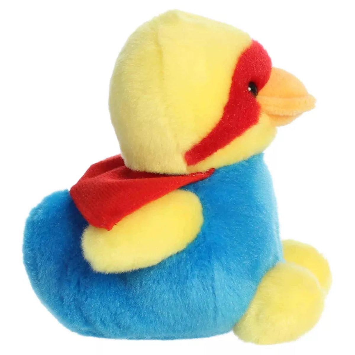 Side profile view of Aurora Palm Pals Super-Sud Super Duck plush showing red superhero cape, yellow wings, and seated posture.
