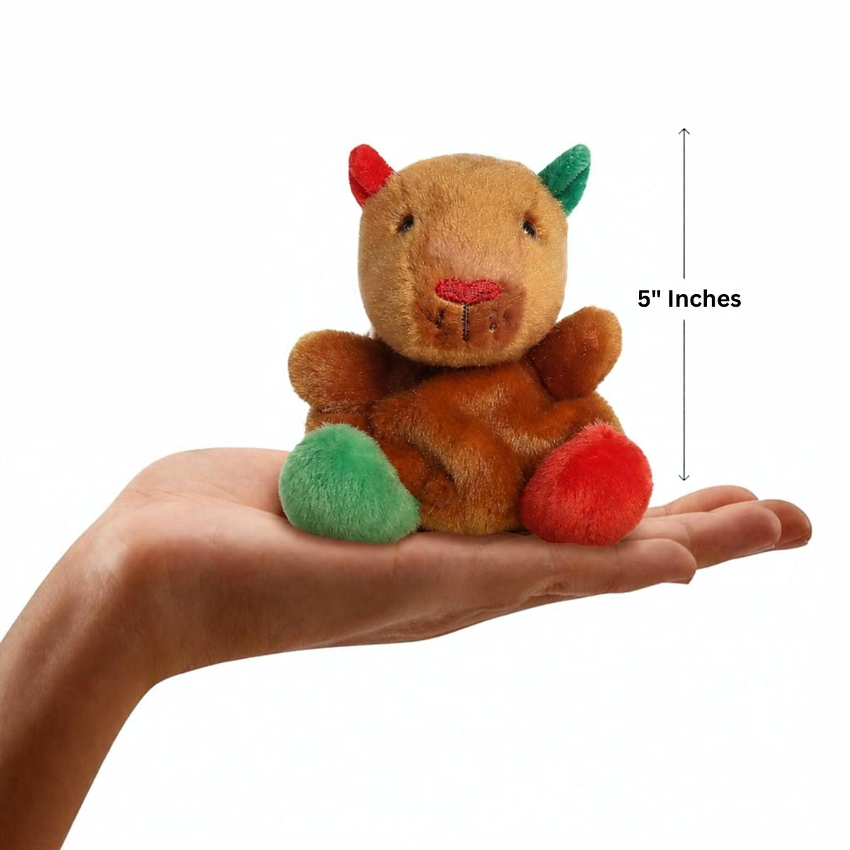 Aurora Palm Pals 5-inch Syd Holiday Capybara plush resting in an open hand with height measurement graphic.