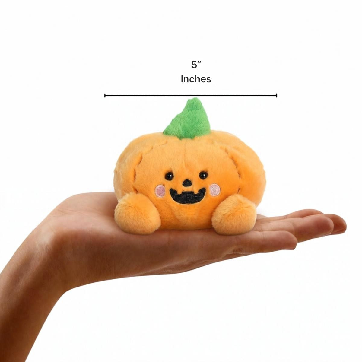 Wisp Jack O'Lantern 5-inch plush sitting in the palm of an open hand showing 5-inch height scale.