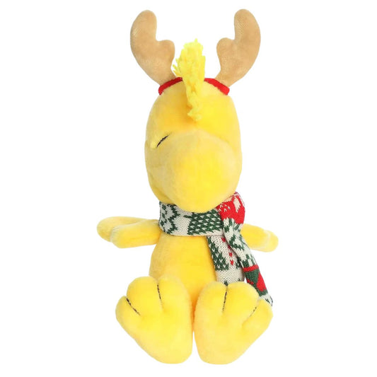 Front seated view of Aurora Peanuts Woodstock plush with reindeer antlers headband and patterned winter scarf.
