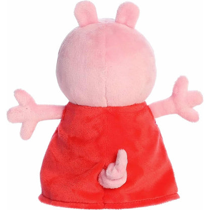 Direct back view of the cuddly Peppa Pig stuffed animal showing the back of her red dress and curly tail.