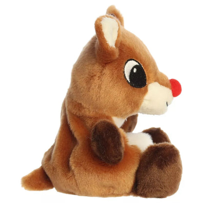 Side profile view of Aurora Rudolph the Red-Nosed Reindeer 5-inch plush showing seated posture and small tail.