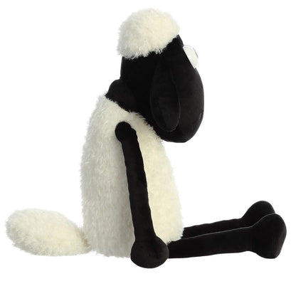 Side profile thumbnail of Shaun the Sheep plush sitting with extended long black legs.