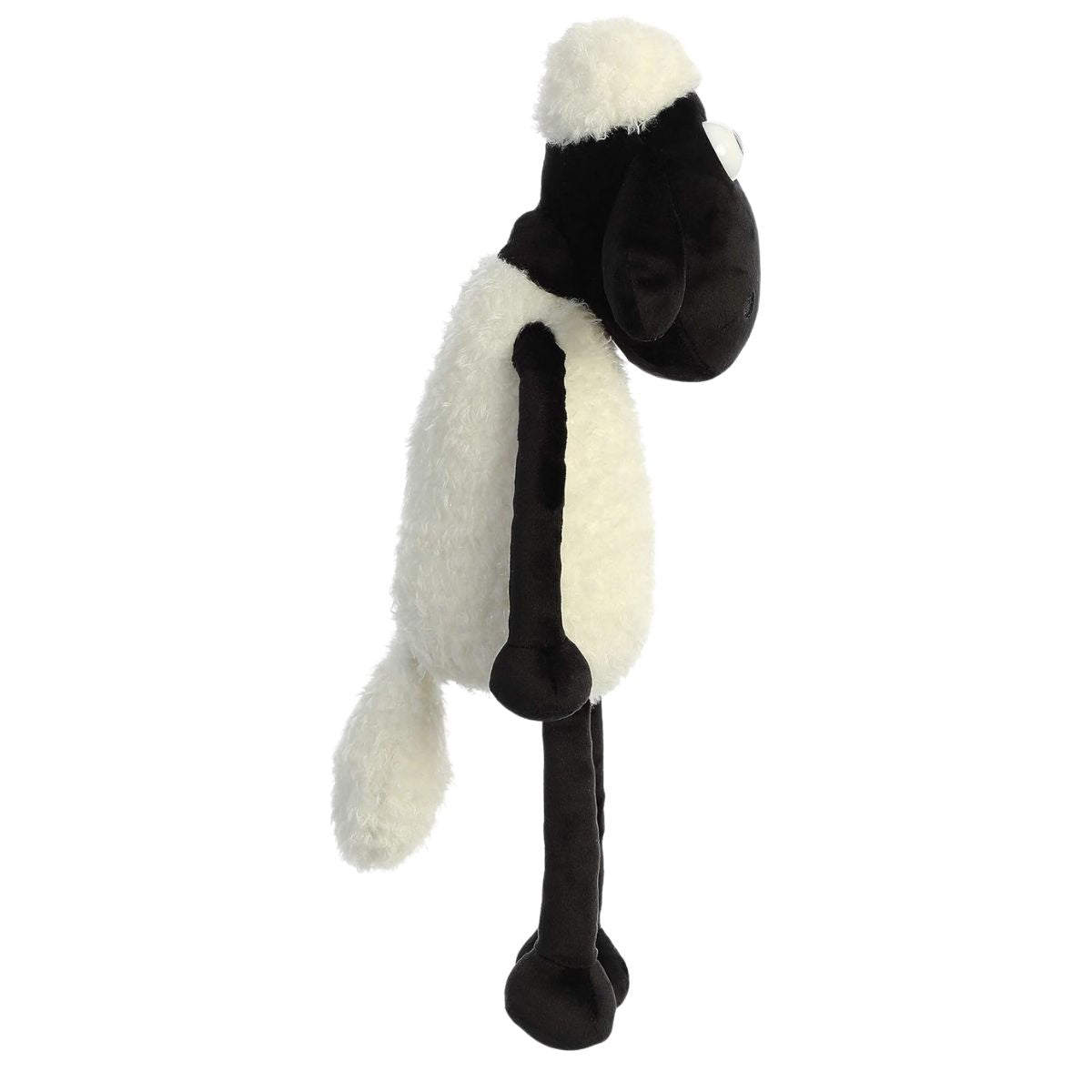 Side view thumbnail of Shaun the Sheep plush standing upright on long black legs.