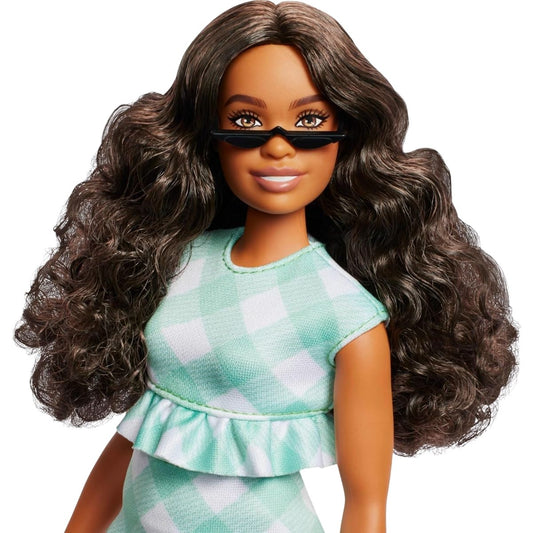 Close-up portrait view of Barbie #240 displaying voluminous dark brown wavy hair and black sunglasses.
