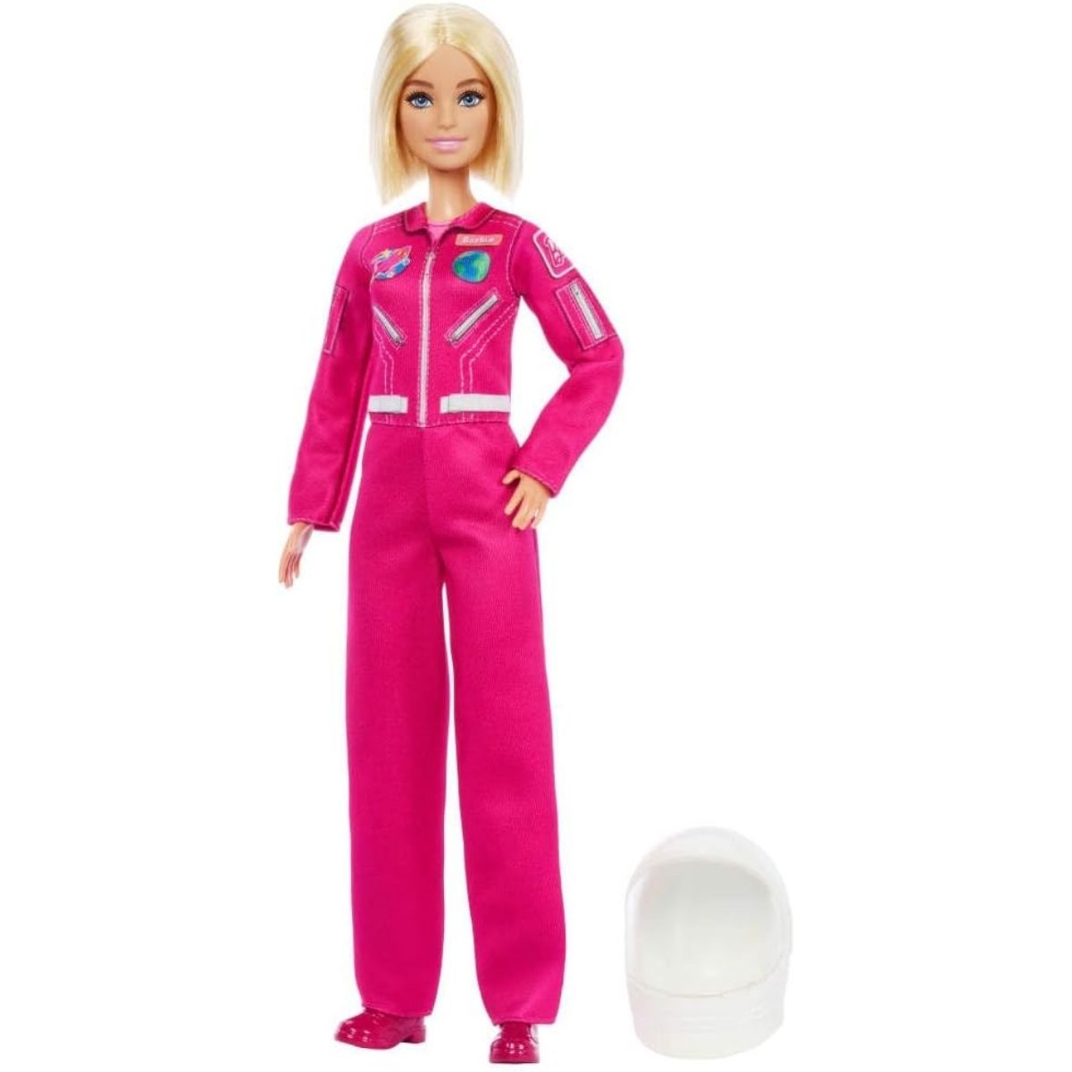 Full-length standing view of 12-inch Barbie Astronaut doll next to her white space helmet on the ground.