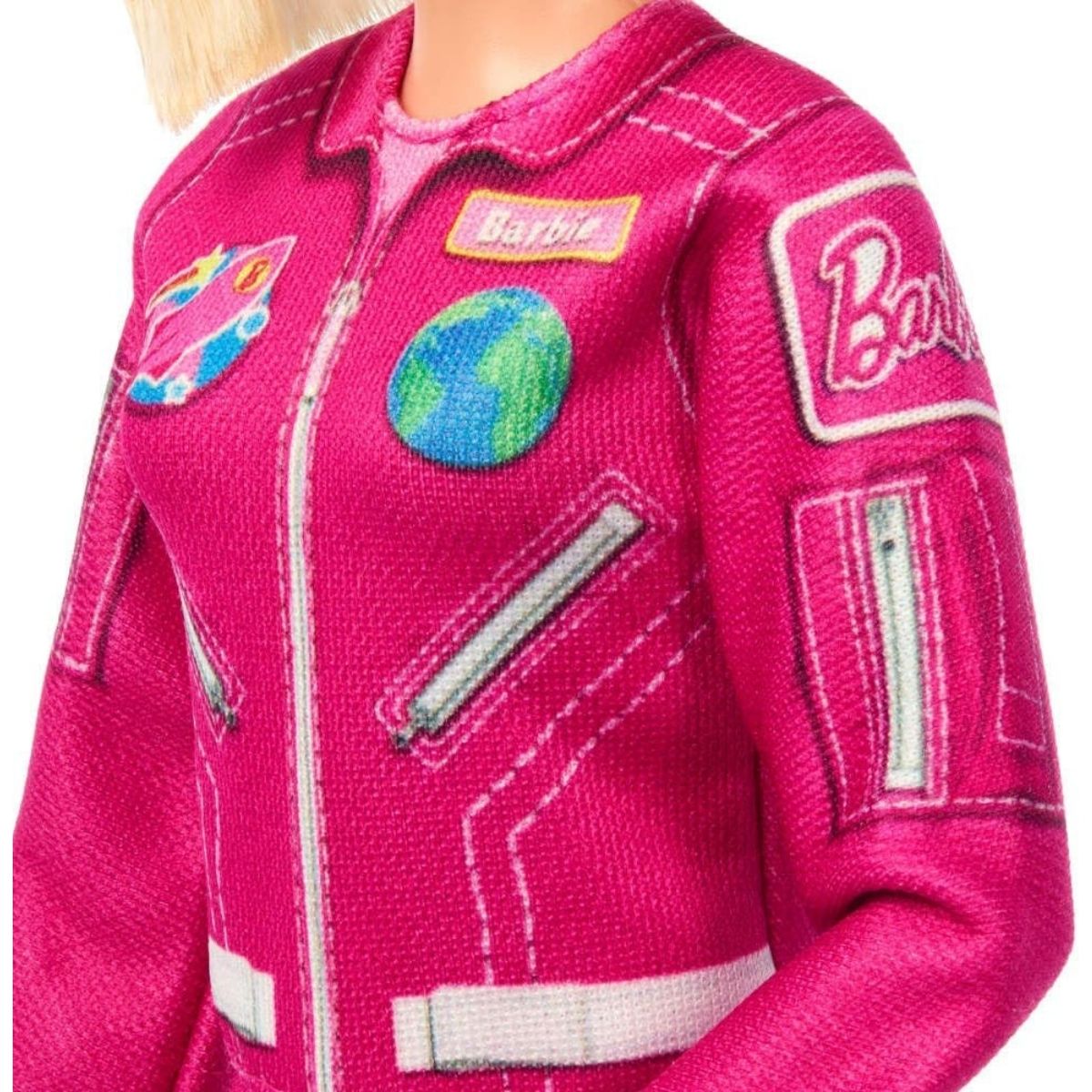 Close-up detail thumbnail of hot pink flight suit chest showing Earth globe and space mission patches.