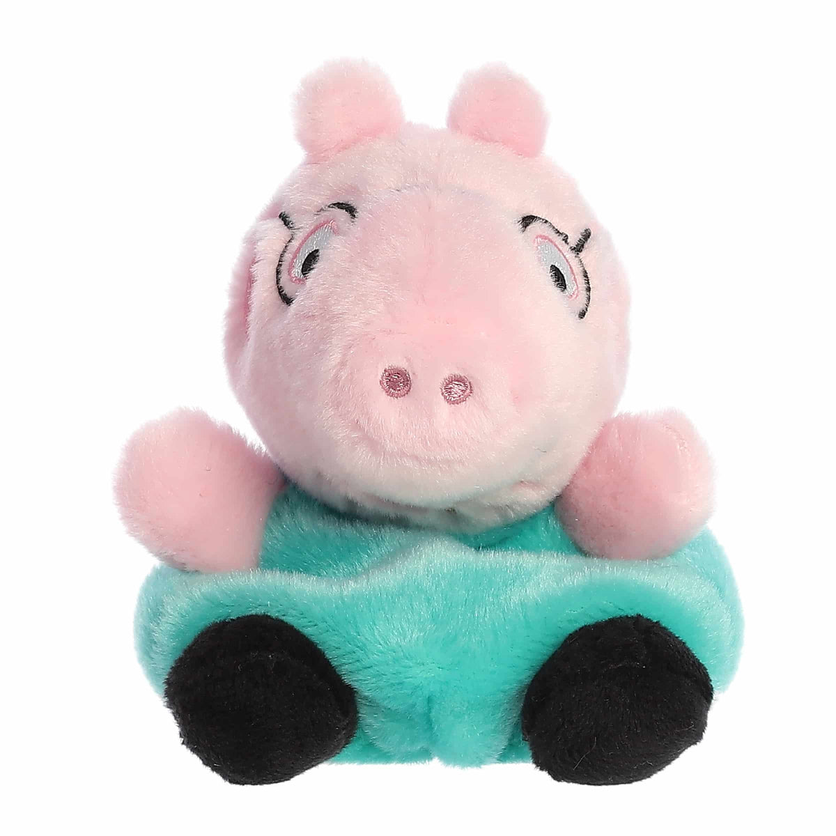 Plush toy of a pink pig character sitting on a green car with a white background