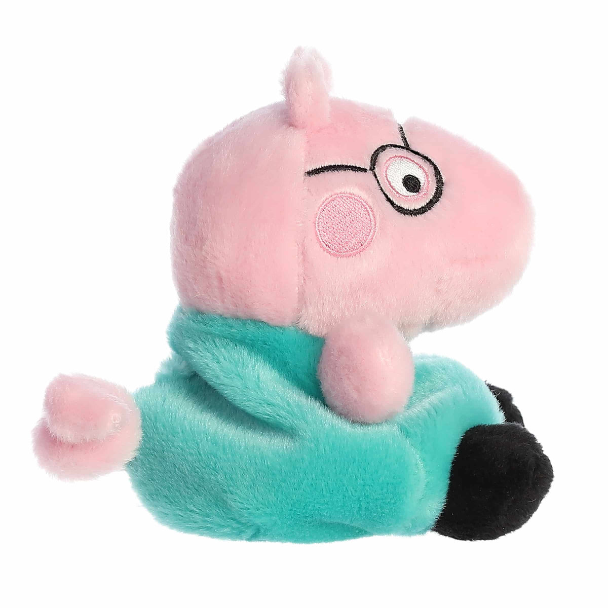 Plush toy of a pink character with glasses and a green outfit on a white background