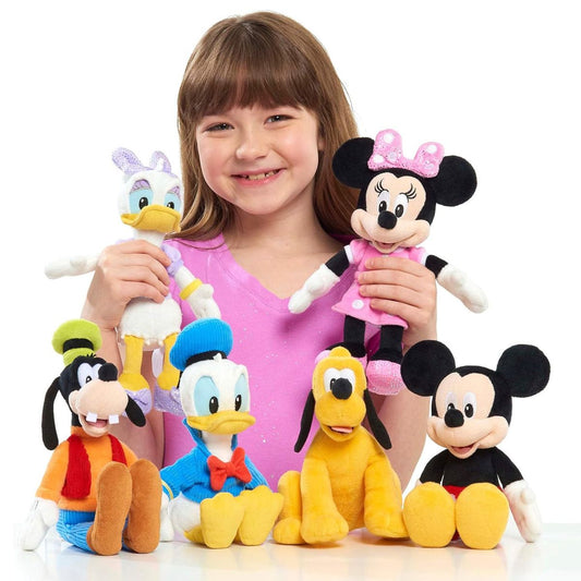 Young girl holding a collection of Disney Junior 9-inch plush toys including Daisy Duck, Minnie, Mickey, Donald, Goofy, and Pluto.