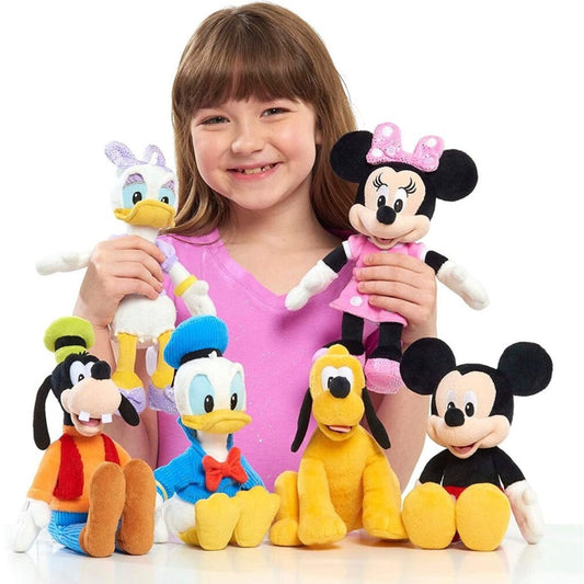 Young girl holding a collection of Disney Junior 9-inch plush toys including Mickey, Minnie, Donald, Daisy, Goofy, and Pluto.