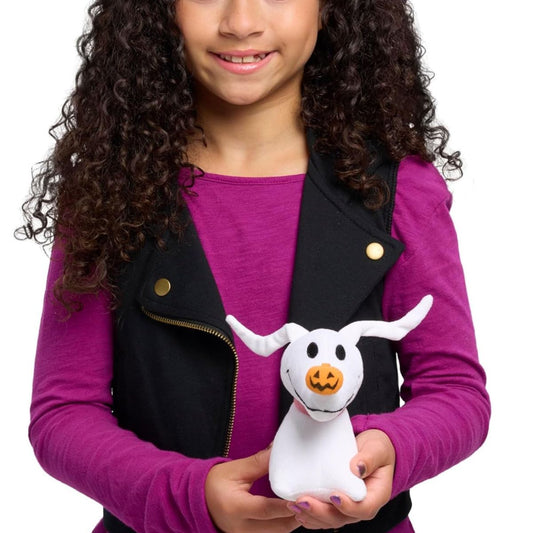 Child holding Disney The Nightmare Before Christmas Zero 5.5-inch plush toy.