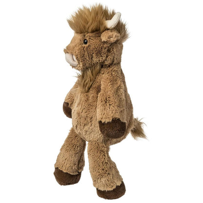 Side view of Hagrid the Highland Cow plush showing long shaggy hair and soft horns.