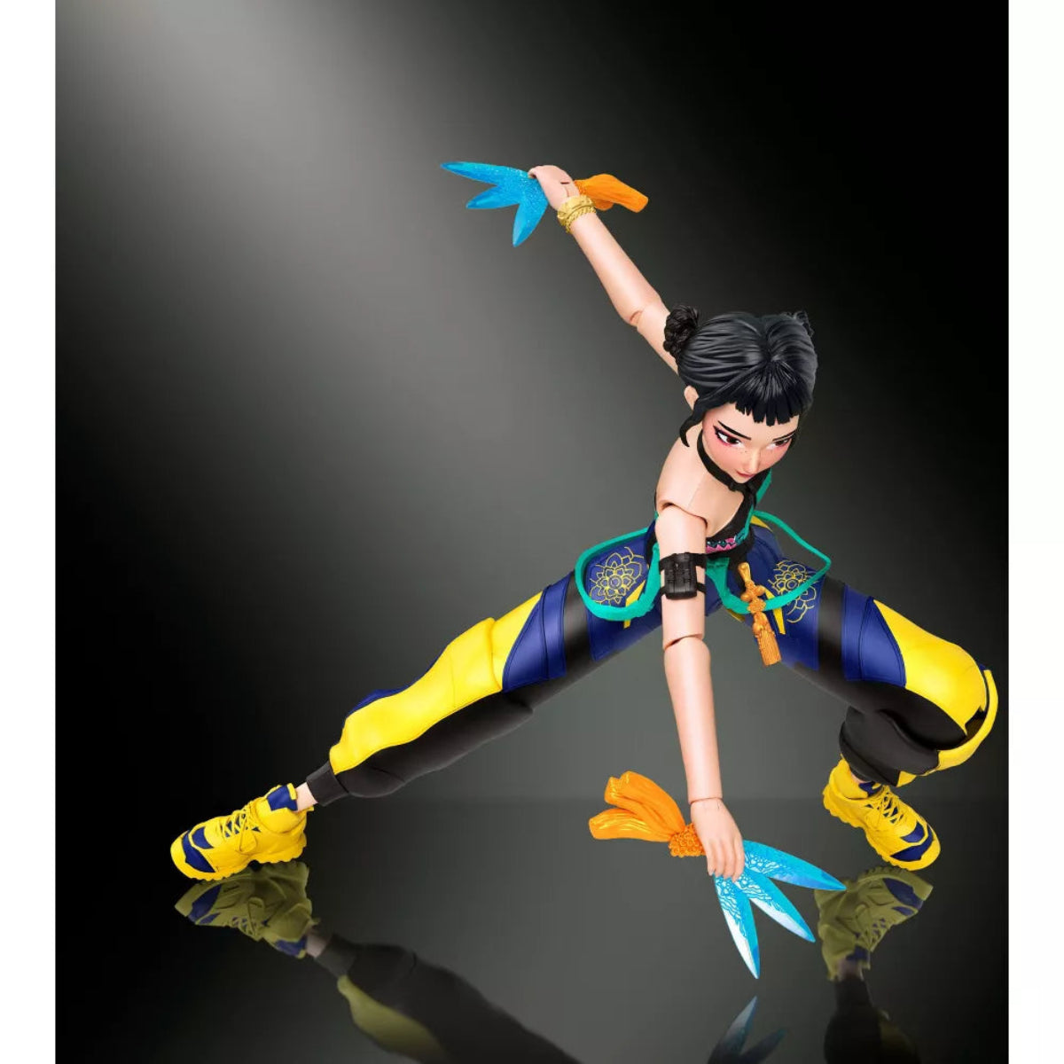 Alt-Text: Zoey action figure in a low martial arts crouch pose holding Spirit Blades.