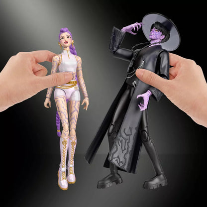 Hands posing Rumi and Demon Jinu action figures showing articulation.