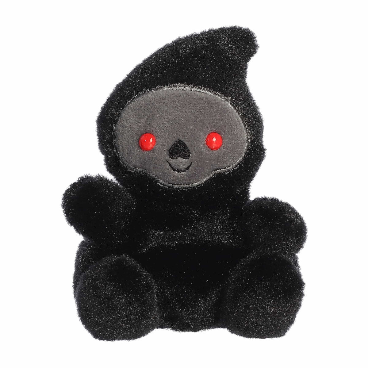Black plush toy with red eyes on a white background