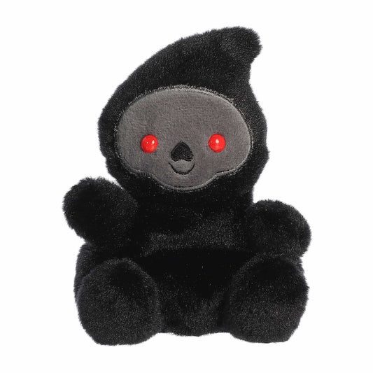 Black plush toy with red eyes on a white background