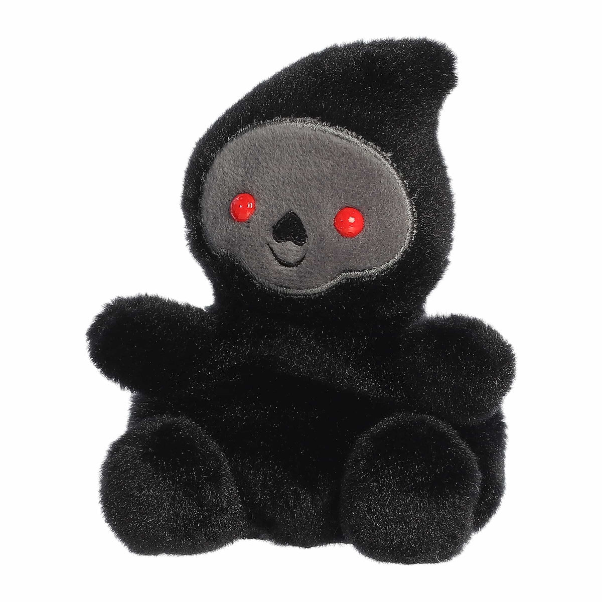 Black plush toy with red eyes on a white background