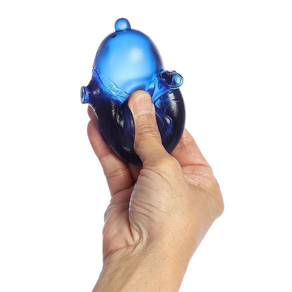 Thumbnail showing a hand squeezing the blue translucent Snoopy Joe Cool sugar squeezy toy.