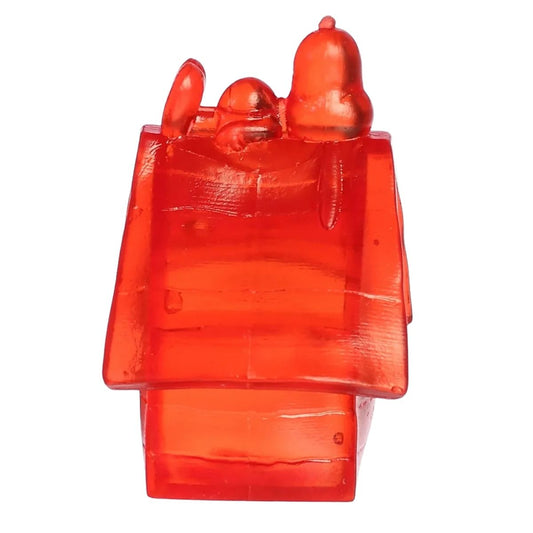 Side profile view thumbnail of red translucent Snoopy's doghouse sugar squeezy toy.