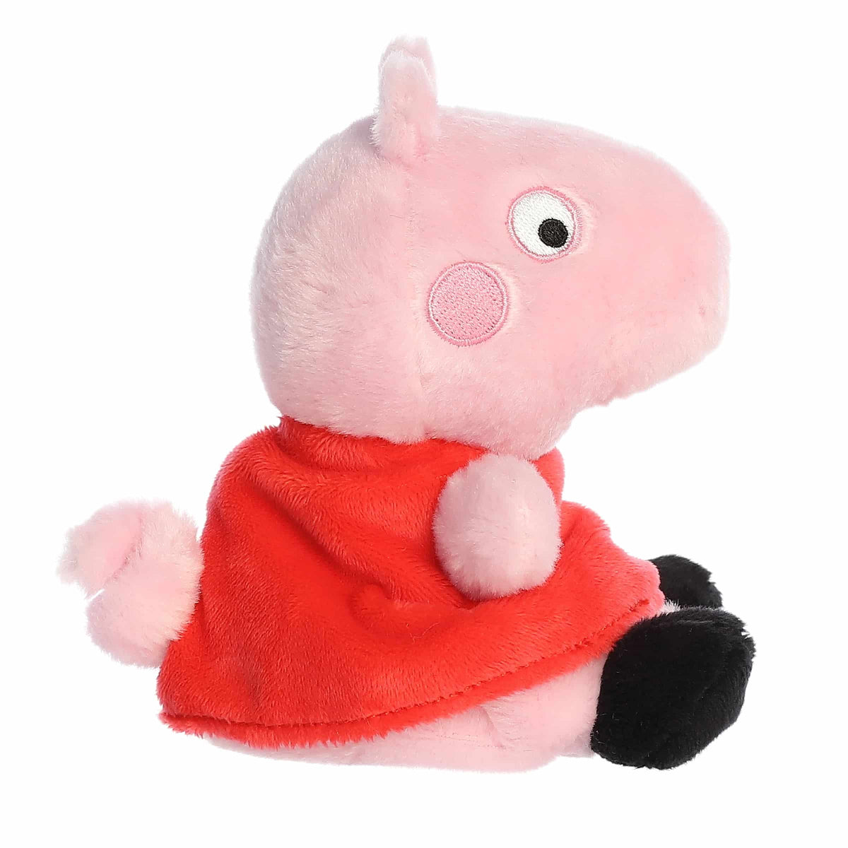 Plush toy of a pink character with a red outfit on a white background