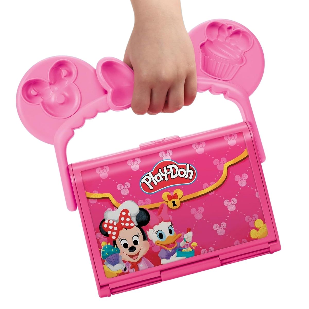 Close-up thumbnail of a child carrying the closed pink Minnie Mouse bakery case by its ear and bow handle.