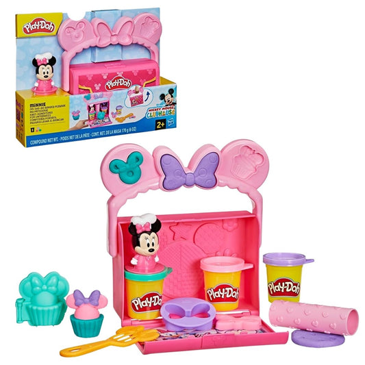 Play-Doh Disney Junior Mickey Mouse Clubhouse Minnie On-the-Go Bakery packaging box next to open pink carrying case with Minnie ears, cupcake molds, rolling pin, and Play-Doh cans.