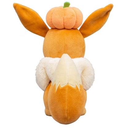 Back view thumbnail of Pokémon Eevee plush showing fluffy tail and rear of pumpkin hat.