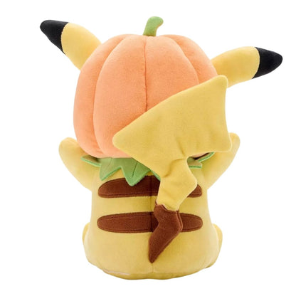 Back view of Pokémon Pikachu plush showing lightning bolt tail and back of pumpkin hood.