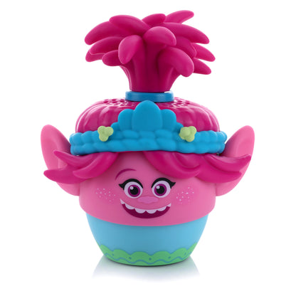 Front view of the Bitty Boomers DreamWorks Trolls Poppy mini Bluetooth speaker featuring her bright pink skin, tied-up pink hair, and blue floral headband.