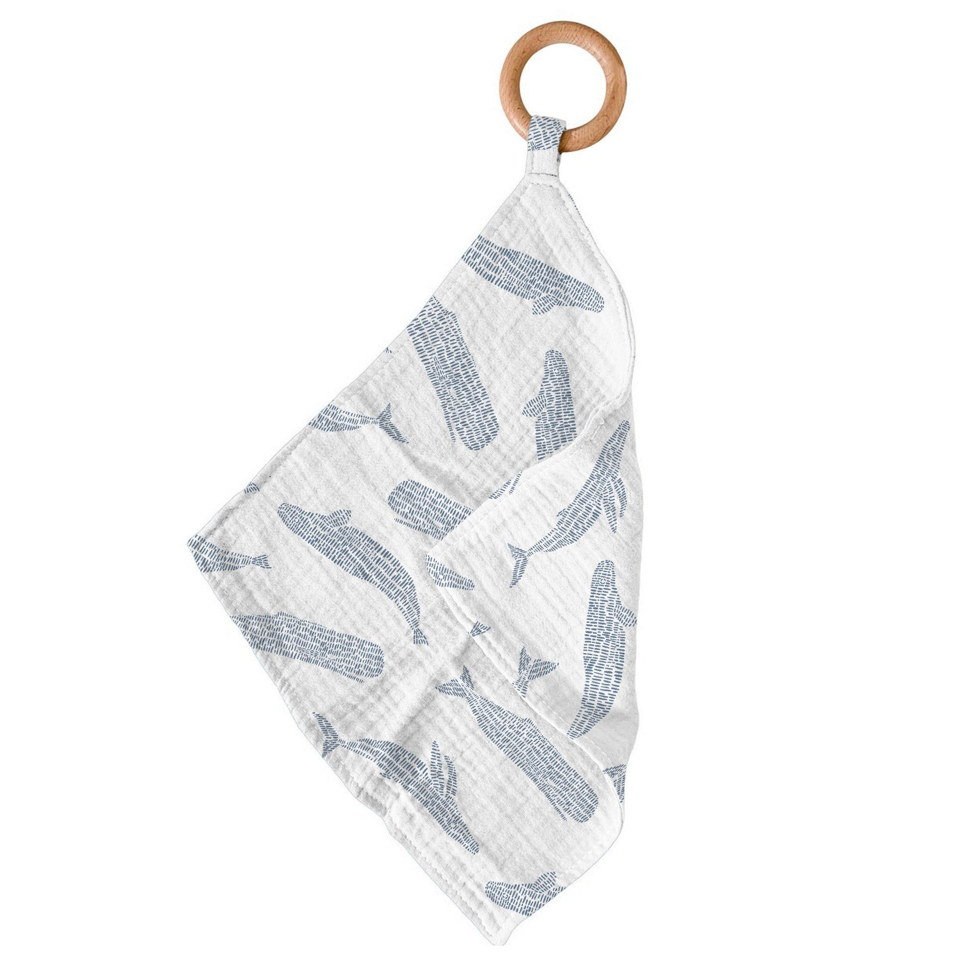 Newcastle Classics Blue Shadow Whales bamboo muslin blankie teether hanging from its smooth natural wood ring.