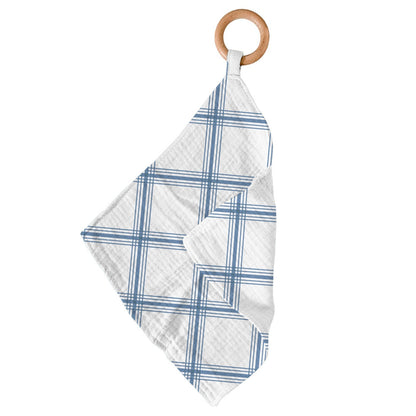 Newcastle Classics Blue Plaid cotton muslin blankie teether hanging from its smooth natural wood ring.