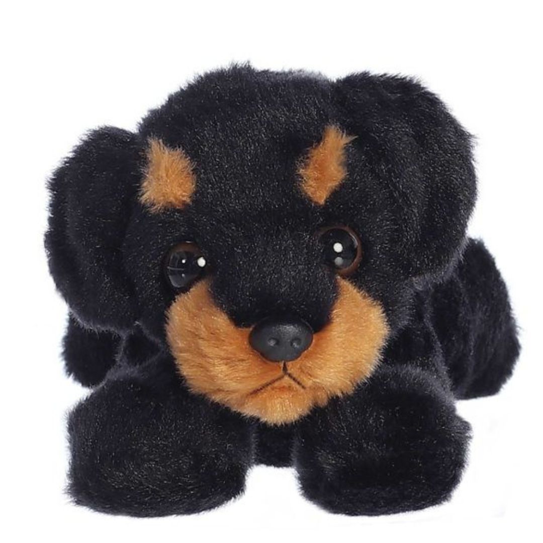 Straight-on front view of the rottweiler puppy stuffed animal highlighting its tan eyebrow spots, tan muzzle, and dark eyes.
