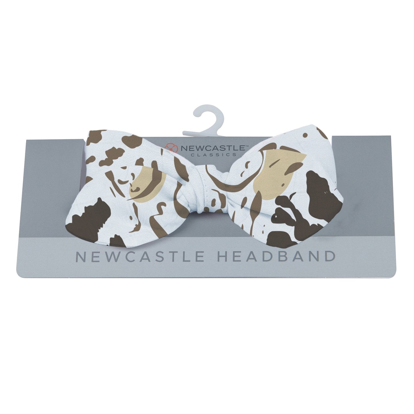 Newcastle Classics animal print baby headband displayed on its grey retail hanging card.