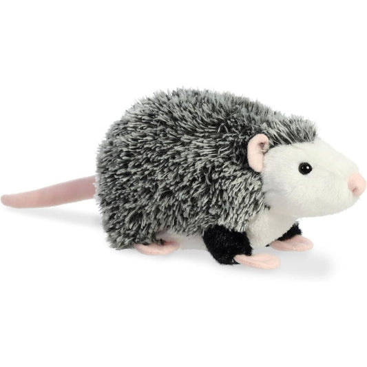 A stuffed animal plush toy resembling an opossum with gray and white fur, black feet, and a pink nose.