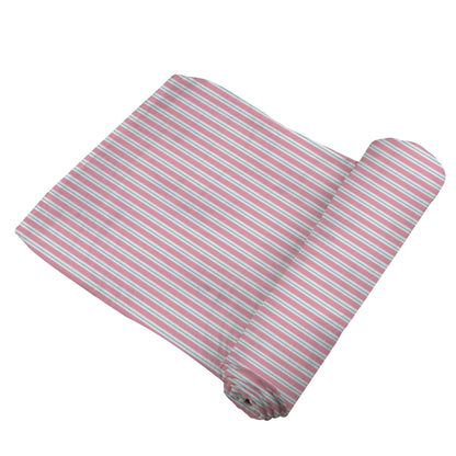 A partially unrolled bamboo muslin swaddle featuring a classic pink and white pinstripe pattern.