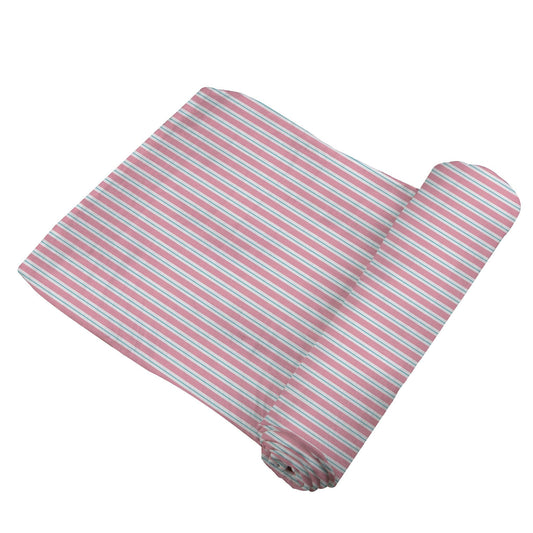 A partially unrolled bamboo muslin swaddle featuring a classic pink and white pinstripe pattern.