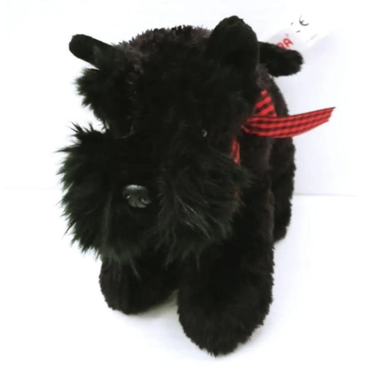 Front view of the Mini Flopsie Scottish Terrier plush toy highlighting its shaggy jet-black face, sweet dark eyes, and red plaid collar.