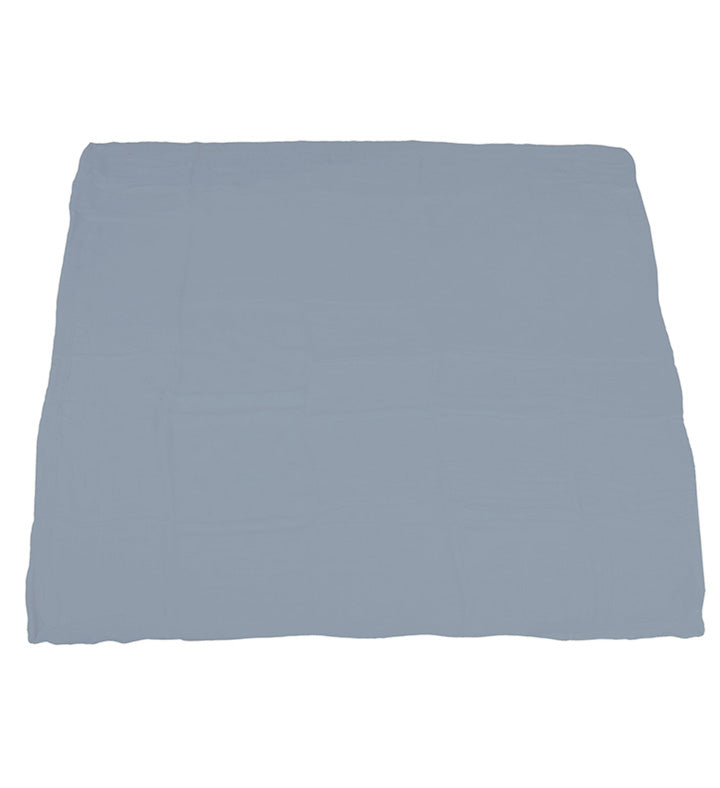 The reversible blanket fully unrolled to display the solid blue fog slate-colored side.
