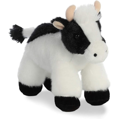 Three-quarter front view of the cow stuffed animal standing up, highlighting its white muzzle, tiny pink horns, and alert ears.