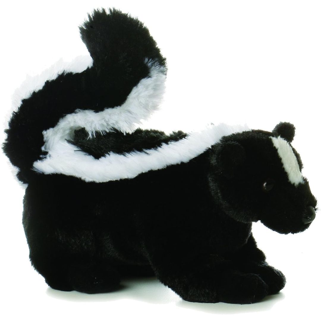 Angled side view of the Aurora Mini Flopsie Lil' Sachet Skunk 8-inch plush resting on its belly, featuring a large, fluffy, curved black-and-white tail.