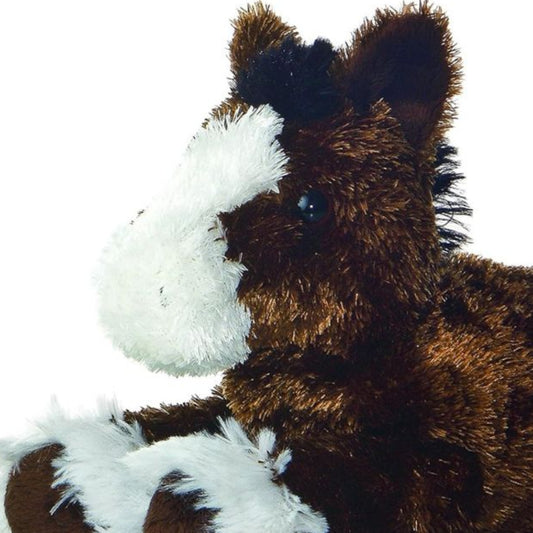 Close-up front angle of the Clydesdale horse stuffed animal highlighting its large white facial blaze and dark eyes.