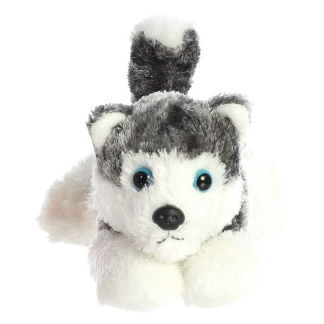 Straight-on front view of the Siberian Husky puppy stuffed animal highlighting its bright blue eyes, black nose, and white paws.