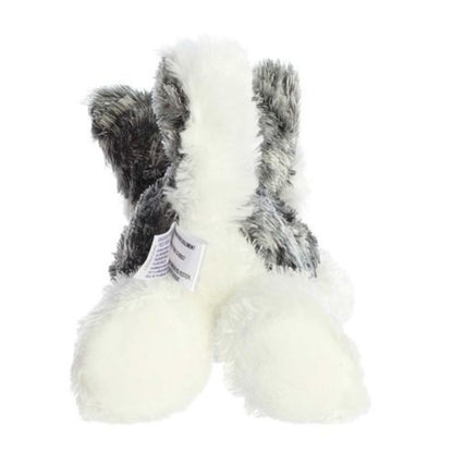 Rear view of the Husky plush showing its textured grey back, white hind legs, and an upright white-and-grey tail.