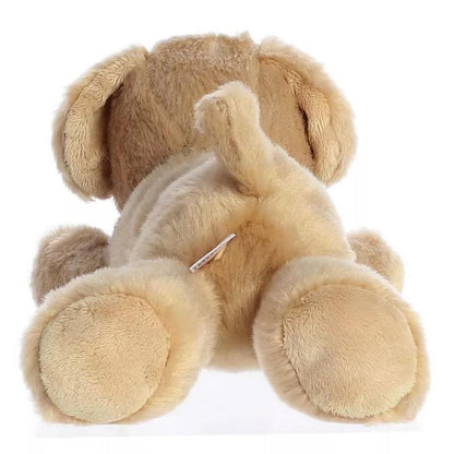 Direct back view of the cuddly Labrador stuffed animal highlighting its short perky tail and back paws.