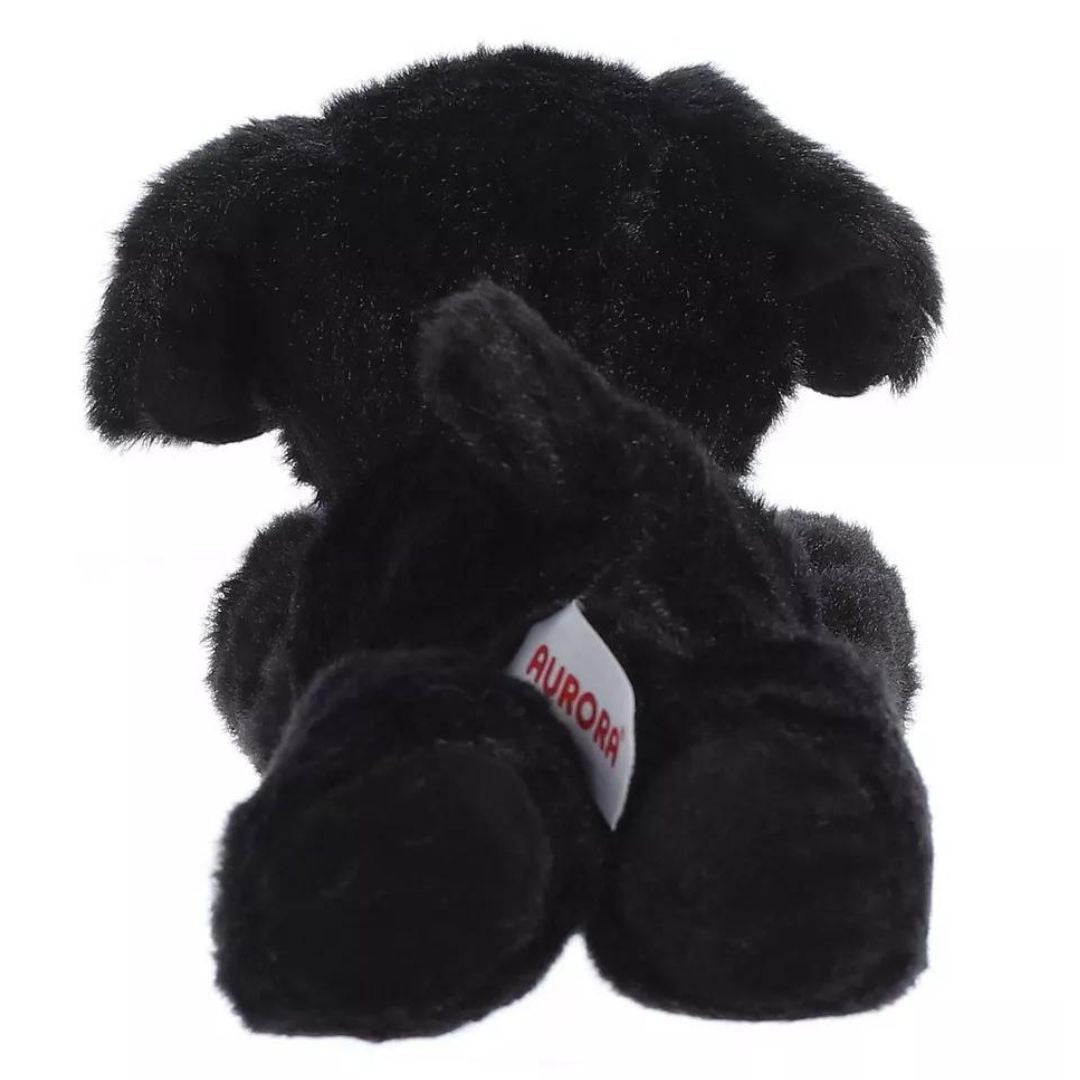 Direct back view of the cuddly Blackie dog plush highlighting its perky black tail and hind paws.