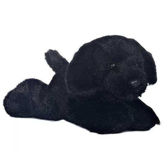 Angled front view of the 8-inch Aurora Mini Flopsie Blackie dog stuffed animal lying down, showing its solid black fur.