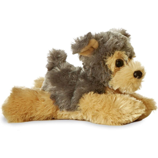 Angled side view of the Aurora Mini Flopsie Cutie Yorkie 8-inch plush resting on its belly, featuring shaggy grey and tan terrier fur.